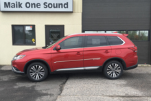 Red 2019 Mitsubishi Outlander with professional window tint